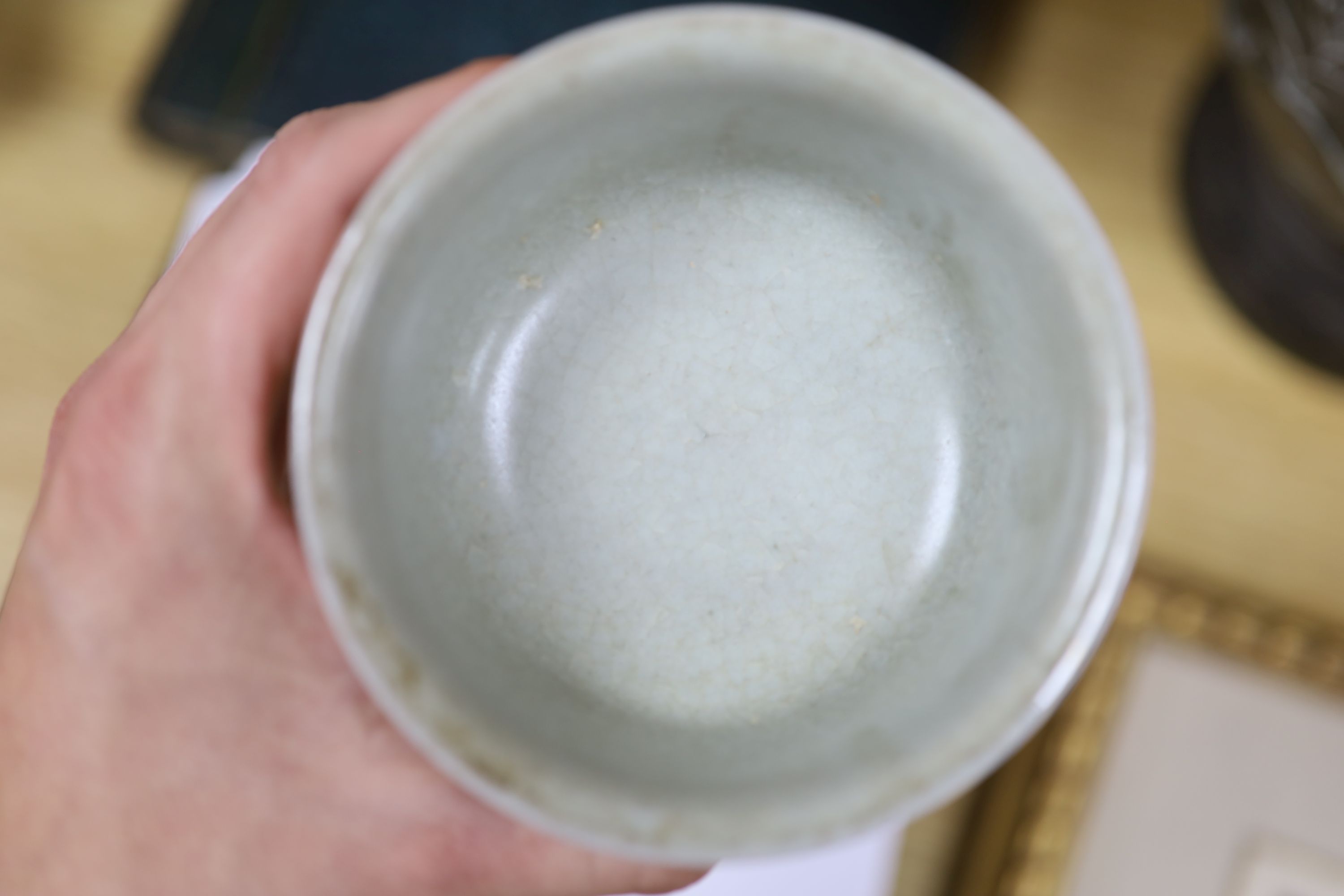 A Chinese blue and white bowl, diameter 15cm, a tea bowl and saucer, a crackleglaze shell dish and a celadon glazed stem cup